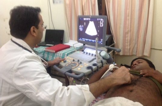 Dr Dinesh doing ultrasound
